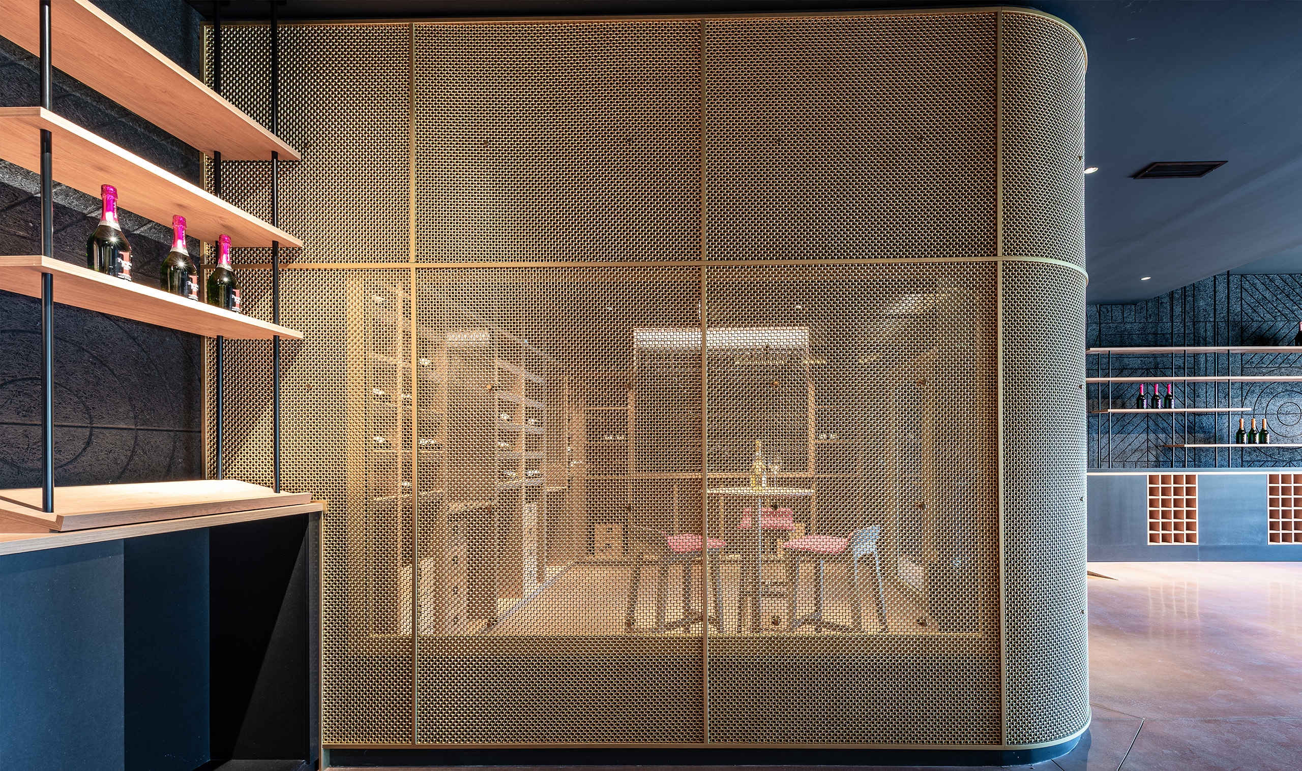M22-83 decorative woven wire mesh in bare brass as a space divider.