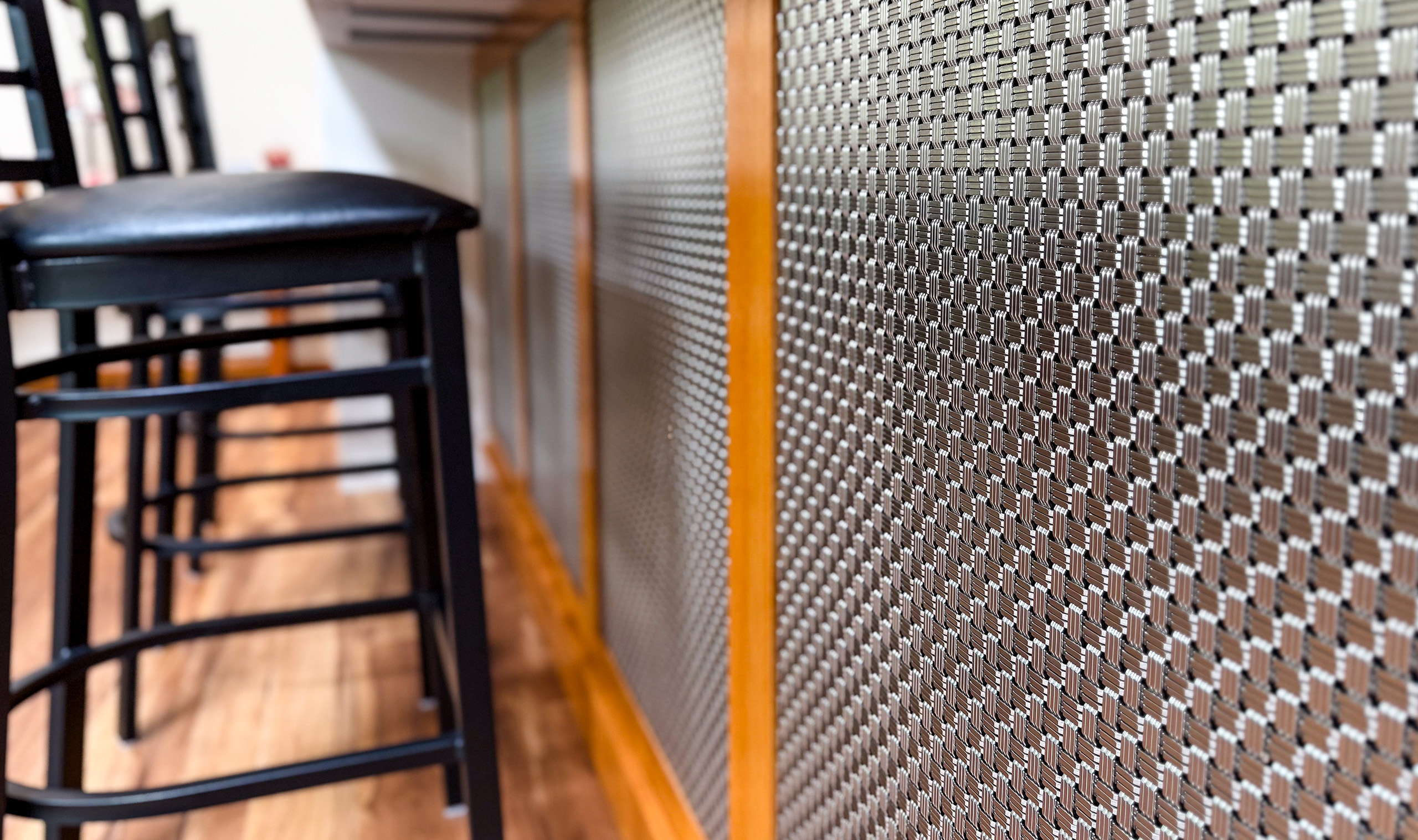 M33-2 Stainless Steel woven wire mesh installed as cladding under a residential bar M33-2 Stainless Steel woven wire mesh installed as cladding under a residential bar