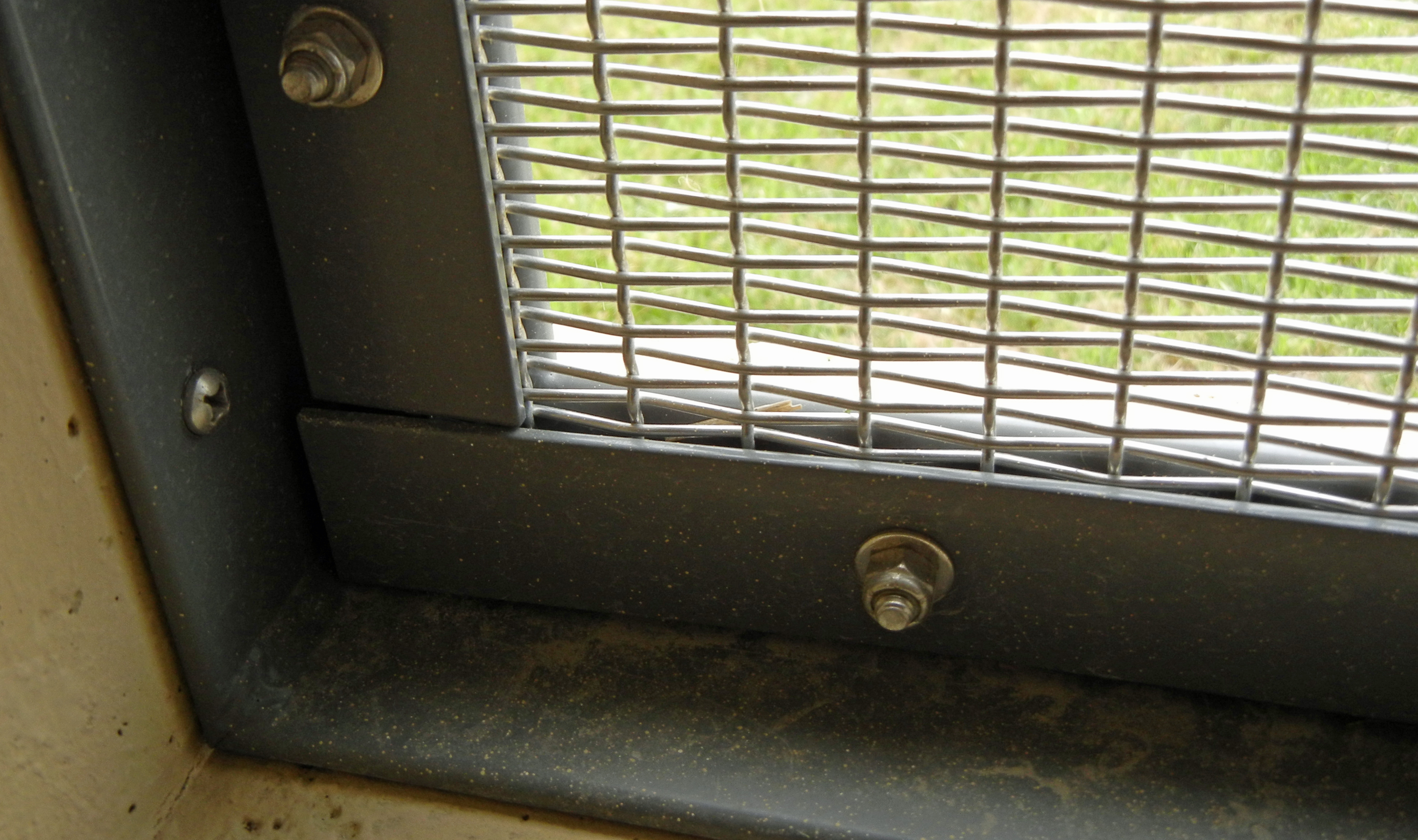  The rectangular plain crimped wire mesh was manufactured to size and were installed using a powder coated angle and bar pressure fit by bolts. 