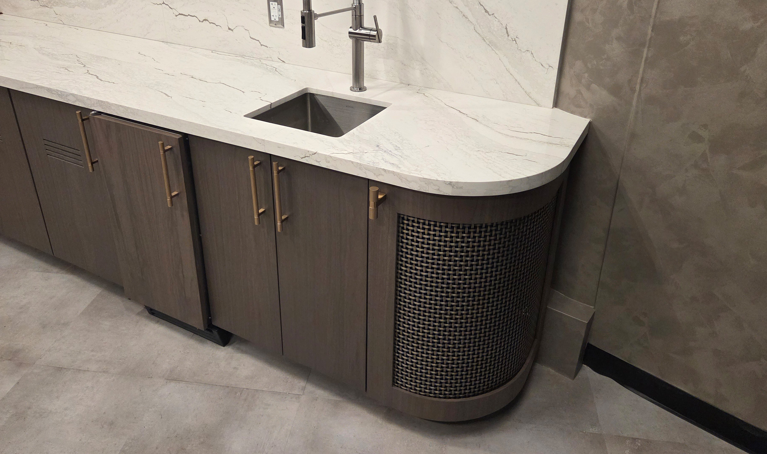S-65 Decorative woven wire mesh in plated antique brass finish as cabinetry infill panel S-65 Decorative woven wire mesh in plated antique brass finish as cabinetry infill panel