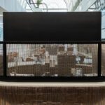 Backside of the Coffee Bar featuring TXZ-3 Architectural Wire Mesh in Plated Antique Brass