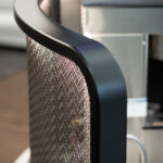 Glimmering TXZ-3 Architectural Wire Mesh in Plated Antique Brass reflecting light
