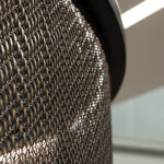 Glimmering TXZ-3 Architectural Wire Mesh in Plated Antique Brass reflecting light