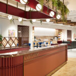 Sancroft Building showcasing modern architecture with abundant natural light, contemporary furnishings, and distinctive design elements such as woven wire mesh from Banker Wire