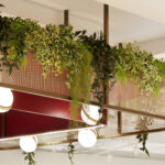 Sancroft Building showcasing modern architecture with abundant natural light, contemporary furnishings, and distinctive design elements such as woven wire mesh from Banker Wire