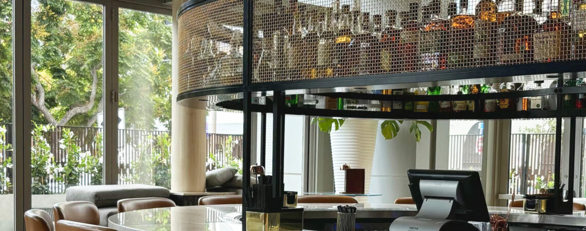 Close-up of L-441 architectural wire mesh woven in bare bronze at Ace Porter bar
