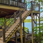 Outdoor deck with silver powder-coated welded wire mesh railing, ideal for easy DIY installation and long-term performance.