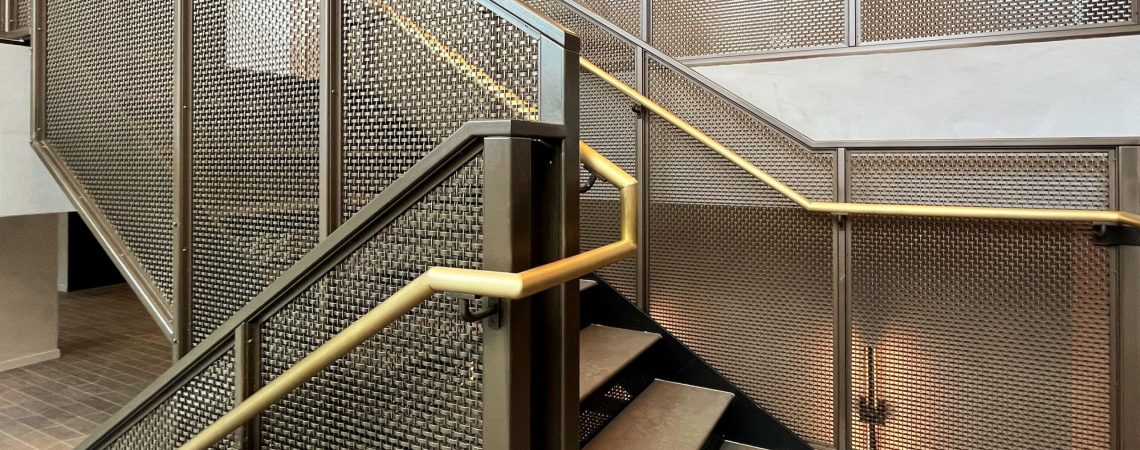 Step into a space where woven wire mesh redefines stairwell design. This New York project blends openness, precision, and bold finishes to create a striking centerpiece for contemporary interiors.