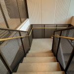 This New York project highlights the beauty and functionality of woven wire mesh in stairwell handrails. This design offers durability, light flow, and a clean aesthetic for upscale commercial spaces.