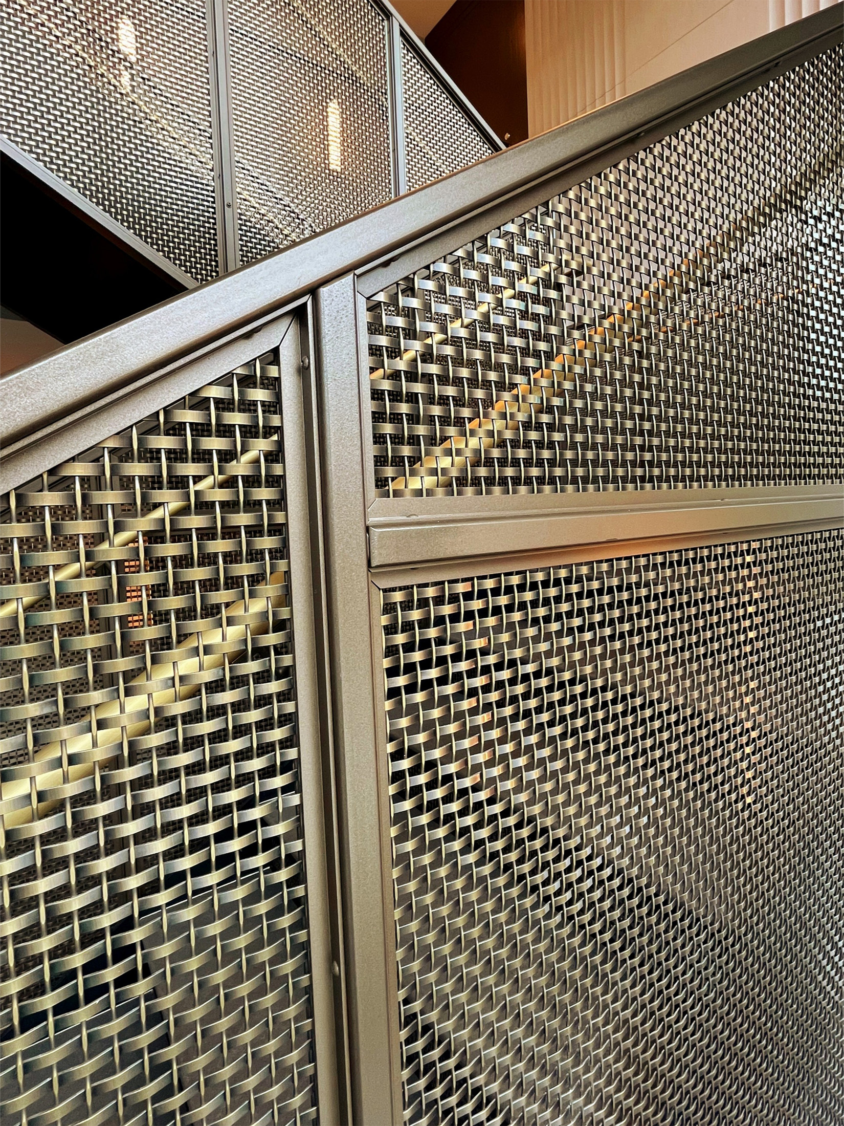 Step into a space where woven wire mesh redefines stairwell design. This New York project blends openness, precision, and bold finishes to create a striking centerpiece for contemporary interiors.