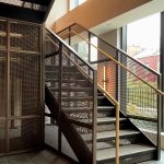 This New York project highlights the beauty and functionality of woven wire mesh in stairwell handrails. This design offers durability, light flow, and a clean aesthetic for upscale commercial spaces.