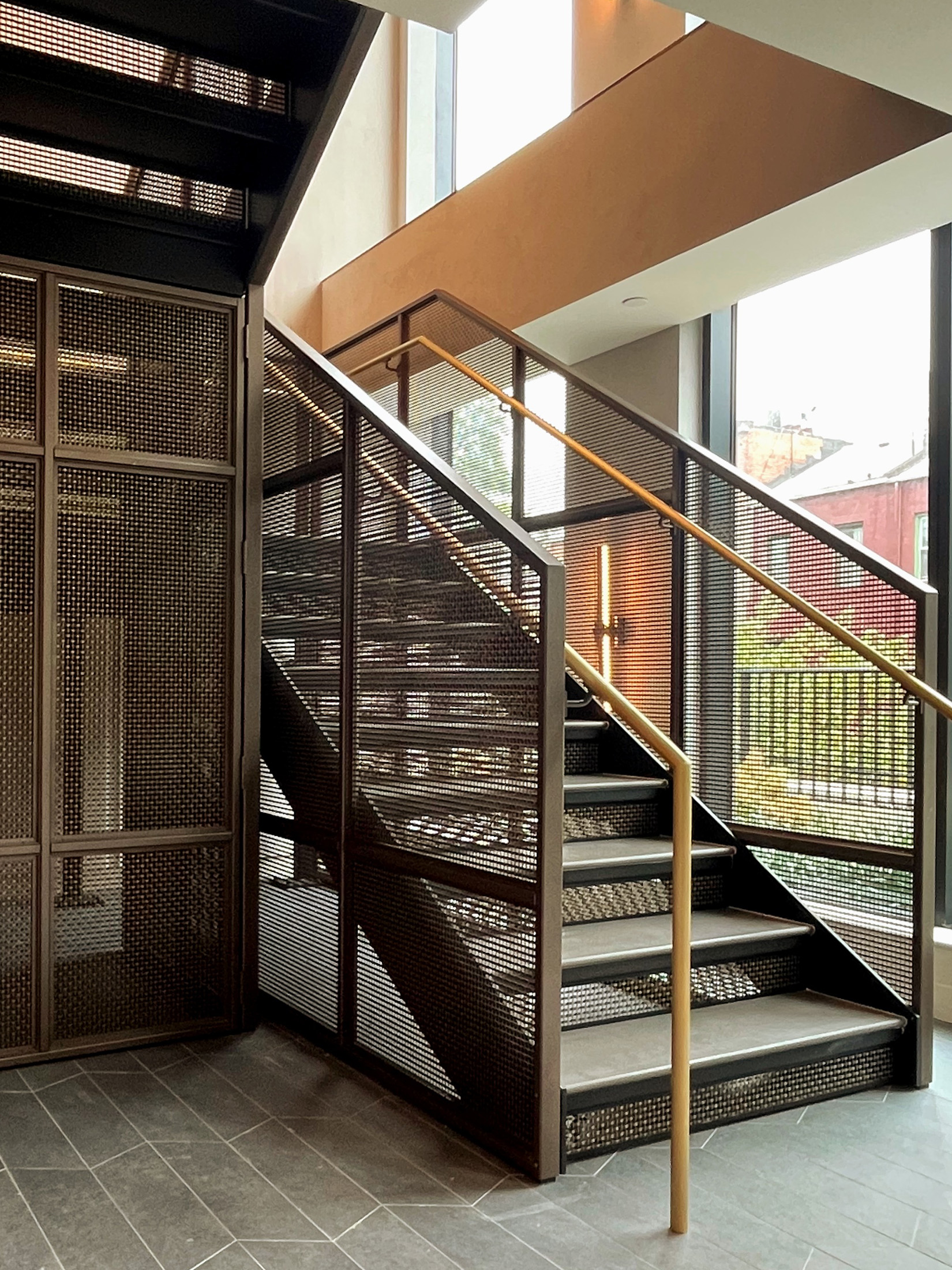 This New York project highlights the beauty and functionality of woven wire mesh in stairwell handrails. This design offers durability, light flow, and a clean aesthetic for upscale commercial spaces.