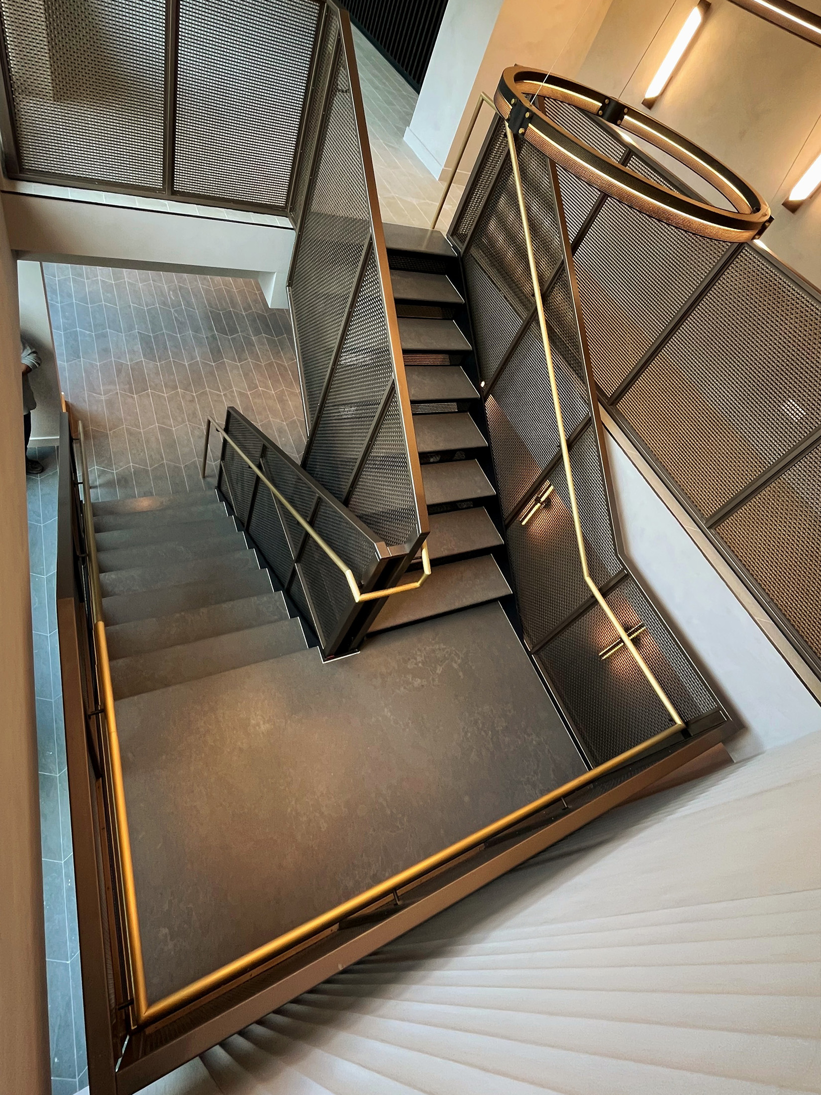Step into a space where woven wire mesh redefines stairwell design. This New York project blends openness, precision, and bold finishes to create a striking centerpiece for contemporary interiors.