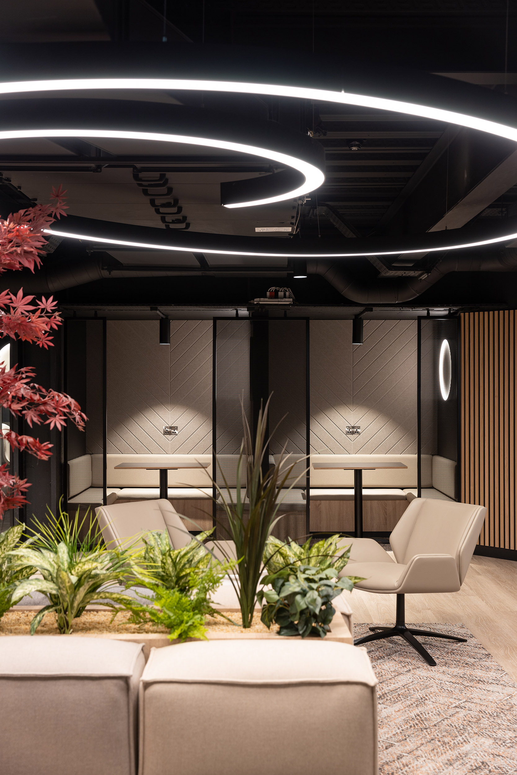 Woven wire mesh space dividers in Banker LPZ-71 create semi‑private seating booths at 58 Mosley Street, adding to the collaborative workplace atmosphere.