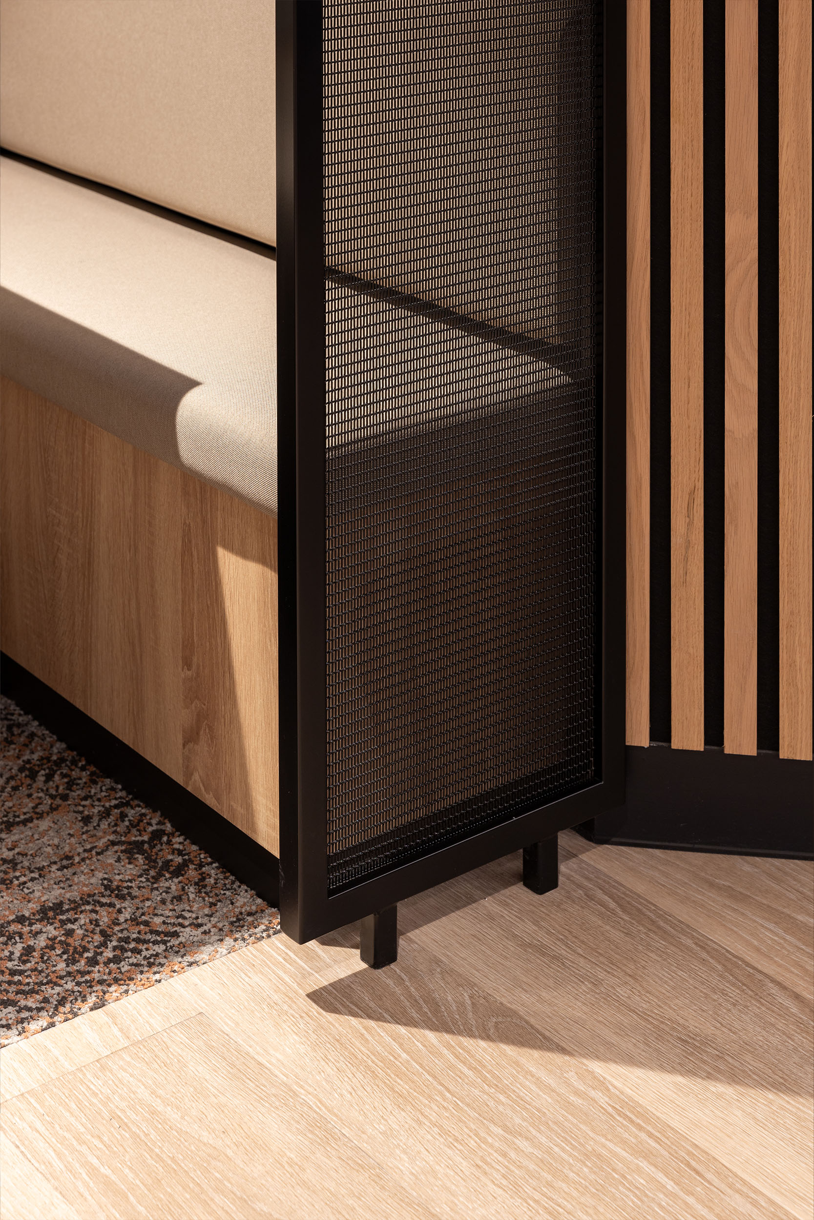 Woven wire mesh space dividers in Banker LPZ-71 create semi‑private seating booths at 58 Mosley Street, adding to the collaborative workplace atmosphere.