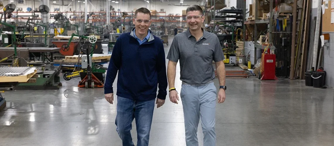 VP Harrison Horan (left) and CEO Tim Frank walk on the plant floor at Banker Wire's 250,000-square-foot facility in Mukwonago. The 130-year-old company is one of many Wisconsin manufacturers that are benefiting from the AI data center boom.