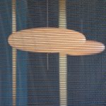 Decorative woven wire mesh IPZ-25 installed in corporate interior design as a space divider.