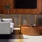 Decorative woven wire mesh installed in corporate interior design as cabinet infill panels