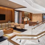 Decorative woven wire mesh installed in corporate interior design as cabinet infill panels