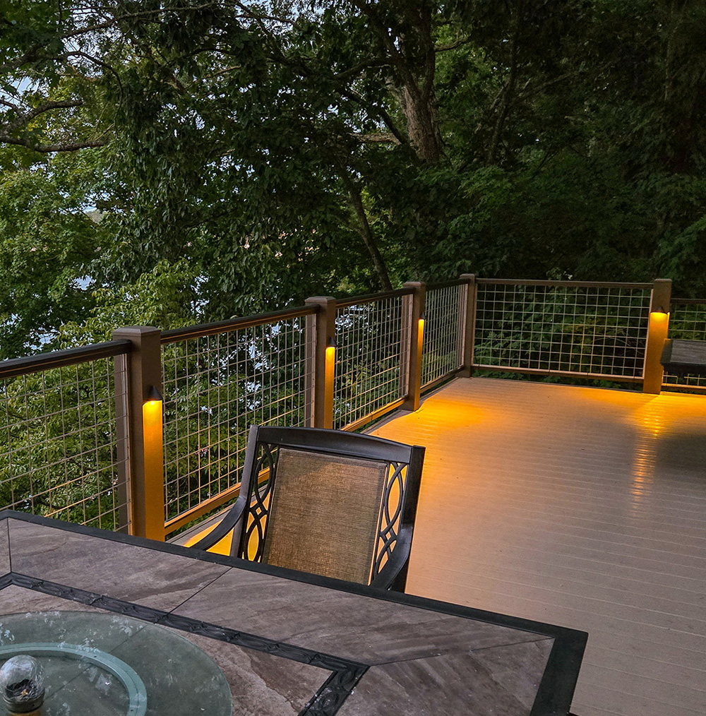 Welded wire mesh installed as handrail infill panels on an outdoor deck at a home Welded wire mesh installed as handrail infill panels on an outdoor deck at a home